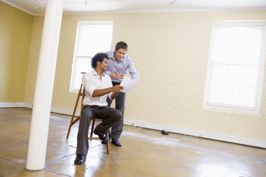 two-men-with-ladder-in-empty-space-looking-at-paper_htaunr0hi two-men-with-ladder-in-empty-space-looking-at-paper_htaunr0hi